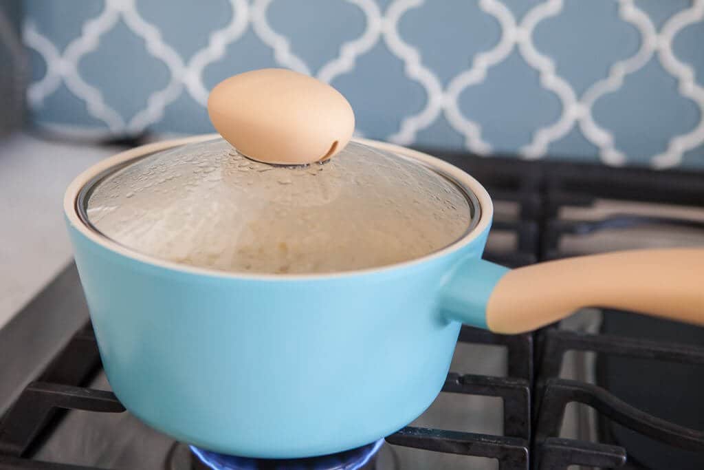 simmering quinoa on the stove